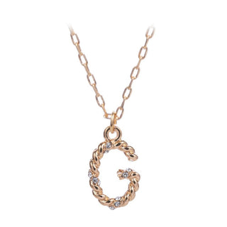 short metal necklace with textured “G” letter pendant