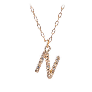 short metal necklace with textured “N” letter pendant