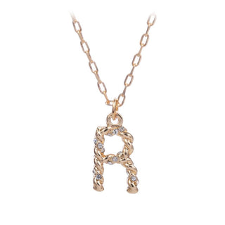 short metal necklace with textured “R” letter pendant