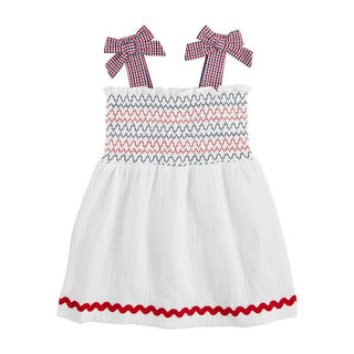 white smocked gauze toddler dress
