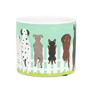 small dogs on fence planter