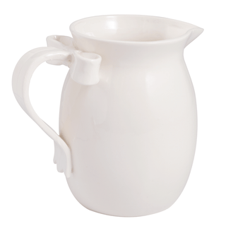 white bow pitcher