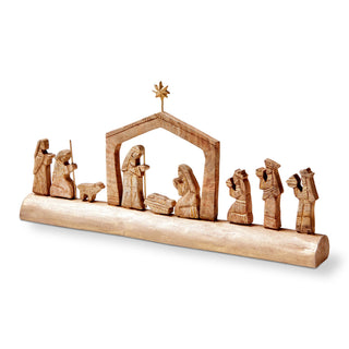 nativity scene on carved wood log