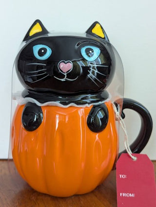 black cat in pumpkin lidded mug